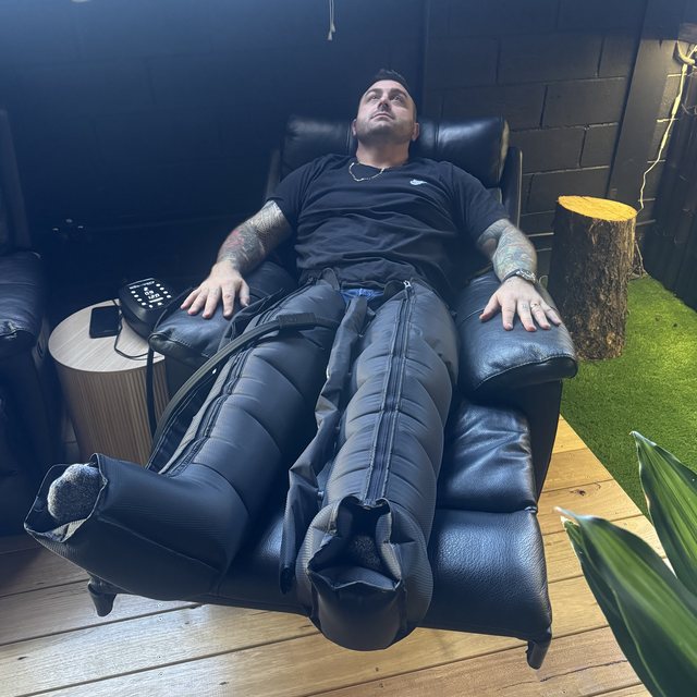 Guest relaxing in compression recovery boots